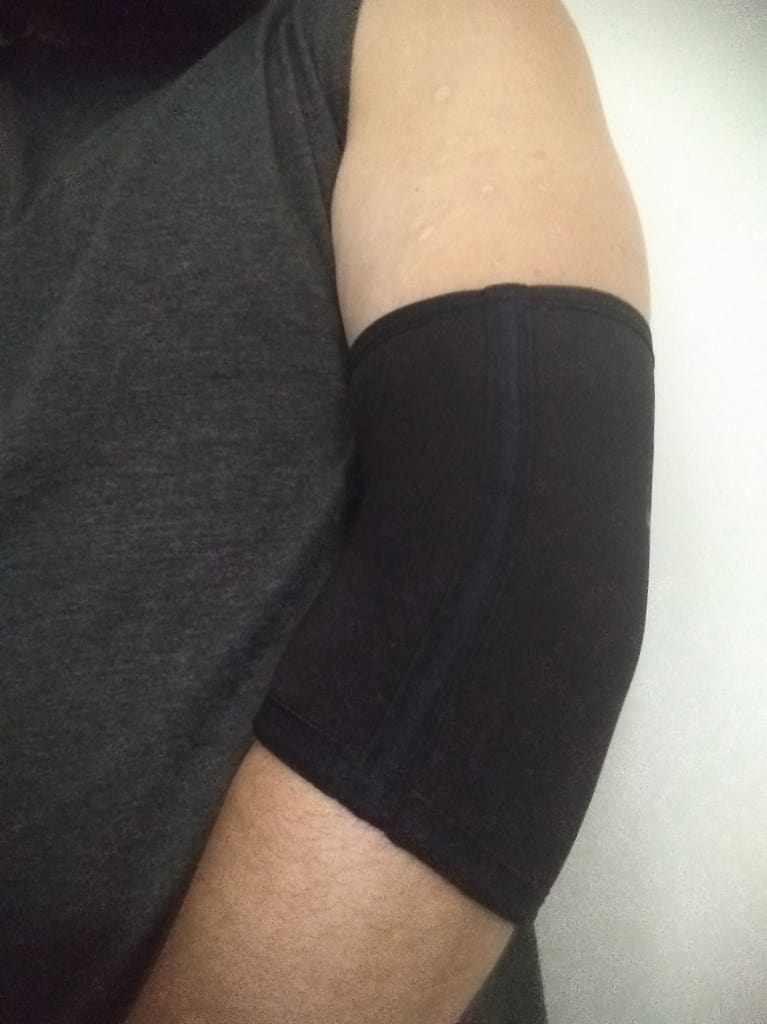 Wearing elbow sleeves on arm